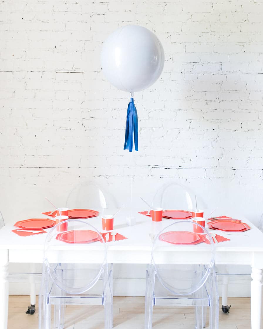 16in White Orb Foil Balloon and Navy Skirt Centerpiece | Purchase 16in White Orb Foil Balloon and Navy Skirt Centerpiece | Purchase